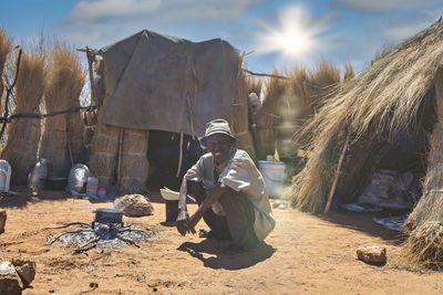 Panoramic view of people sitting on land