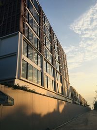 Low angle view of buildings against sky during sunset