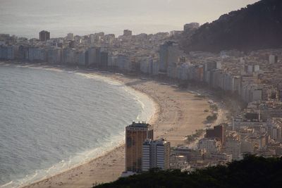 High angle view of city by sea