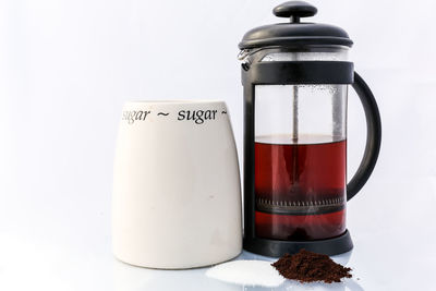 Close-up of coffee served on table against white background