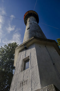 Low angle view of building against blue sky