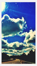 Scenic view of mountains against cloudy sky