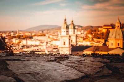 Buildings against sky at sunset