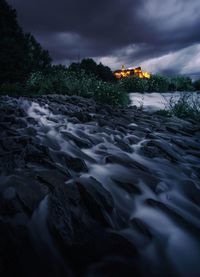 Surface level of river against sky