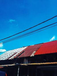 Low angle view of buildings against blue sky