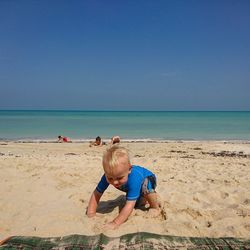 Full length of man on beach against sky