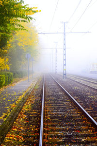 Railroad tracks against sky during autumn