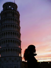 Low angle view of woman tower against sky