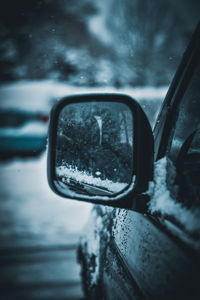 Reflection of car on side-view mirror