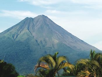 Scenic view of mountains against cloudy sky