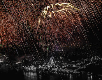 Full frame shot of illuminated water against sky at night