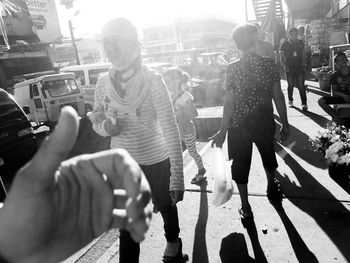 People walking on road in city