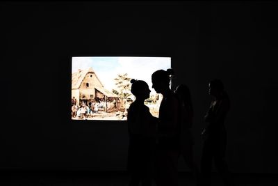 People standing in front of museum