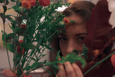 Portrait of woman with red flowers