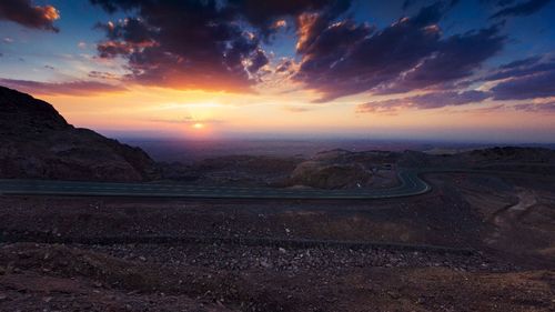 Dramatic sky over landscape during sunset