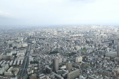 Aerial view of cityscape against sky