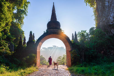 Rear view of women walking in temple