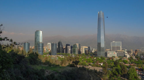 Modern buildings in city against sky