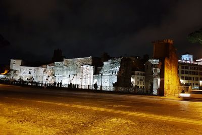 Buildings in city at night