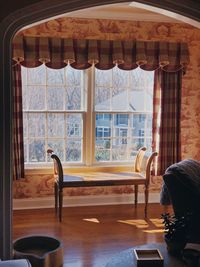 Chair and table against window at home