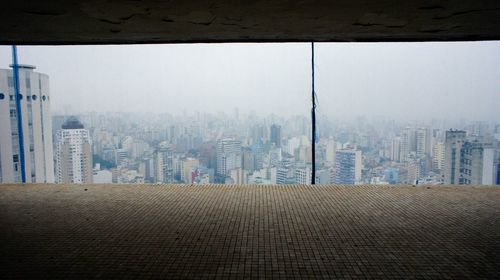 Modern buildings in city against sky