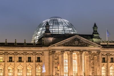 Facade of historical building at dusk