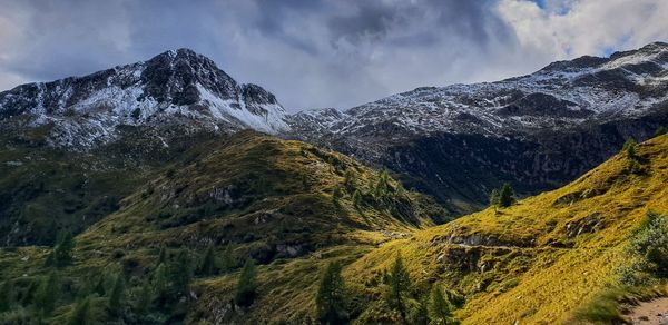 Scenic view of snowcapped mountains against sky