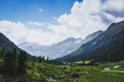 Scenic view of landscape and mountains against sky