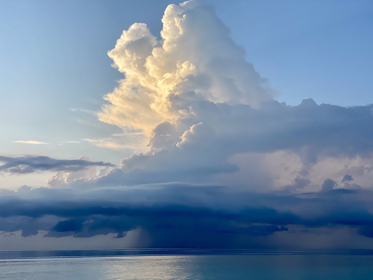 sky, cloud, water, beauty in nature, nature, sea, scenics - nature, horizon, environment, blue, tranquility, ocean, sunlight, no people, outdoors, travel, idyllic, dramatic sky, landscape, dusk, cloudscape, tranquil scene, land, reflection, sunset, day, horizon over water, mountain, travel destinations