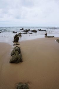 Scenic view of beach against sky