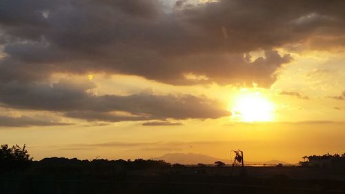 Scenic view of silhouette against sky during sunset