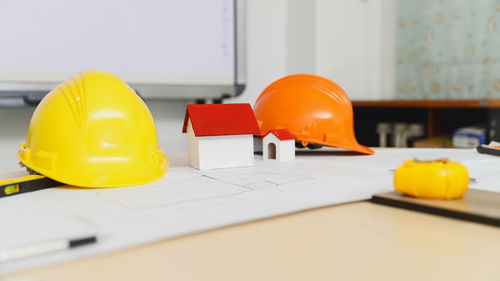 Close-up of yellow hat on table