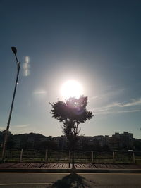 Street against sky during sunset