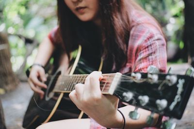 Woman playing guitar