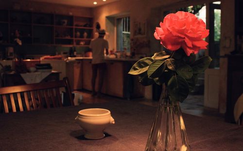 Close-up of flower vase on table at home
