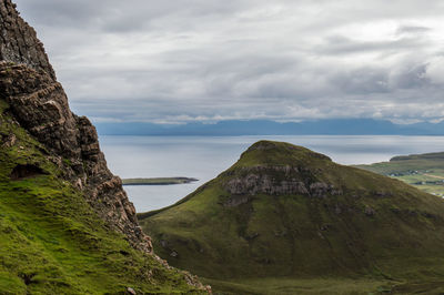 Scenic view of sea against landscape