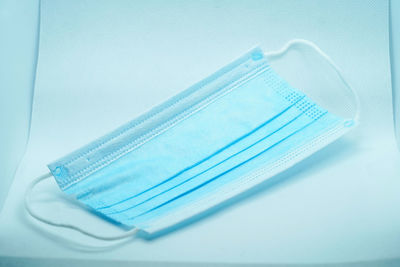 High angle view of blue buttons against white background