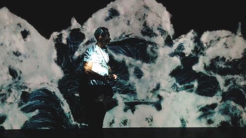 Full length of man standing in snow