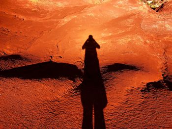 Shadow of person on rock