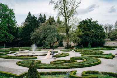 View of garden in park against sky