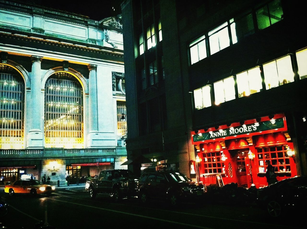 architecture, built structure, building exterior, illuminated, night, city, window, building, transportation, text, no people, street, city life, western script, outdoors, incidental people, arch, facade, glass - material