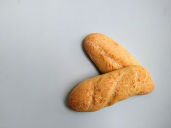 High angle view of bread on white background