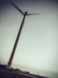 Low angle view of windmill against sky