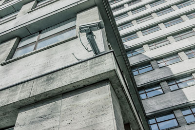 Low angle view of security camera on building