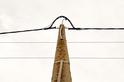 Low angle view of cables against clear sky