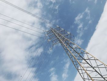 Low angle view of cables against blue sky