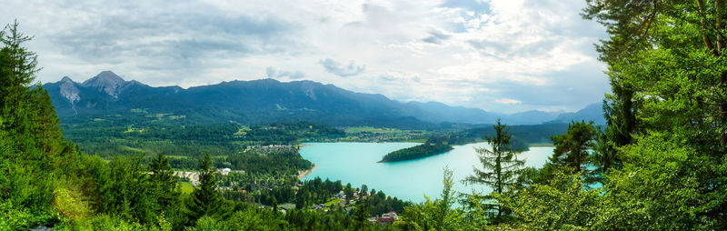 Scenic view of lake and mountains against sky