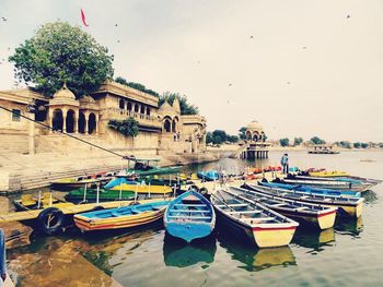 Boats moored in city