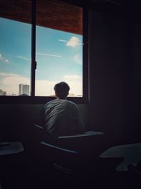 Potrait morning class at gunadarma university depok with lonely man see a blue sky from a window