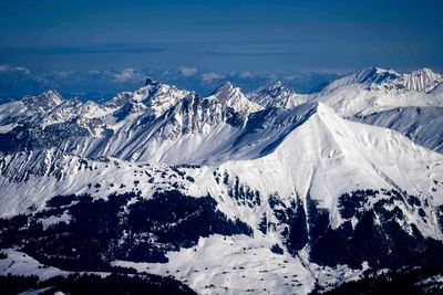 Scenic view of snowcapped mountains against sky